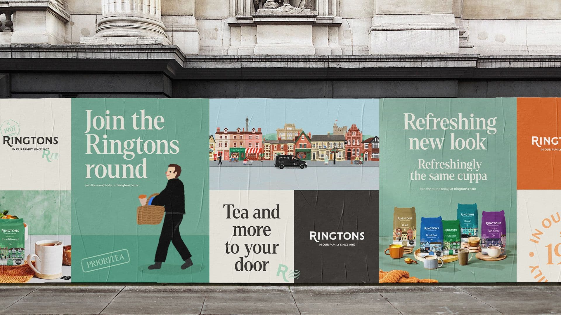 Wide outdoor hoarding featuring Ringtons "Join the round" campaign illustrations and product photos on a stone building.