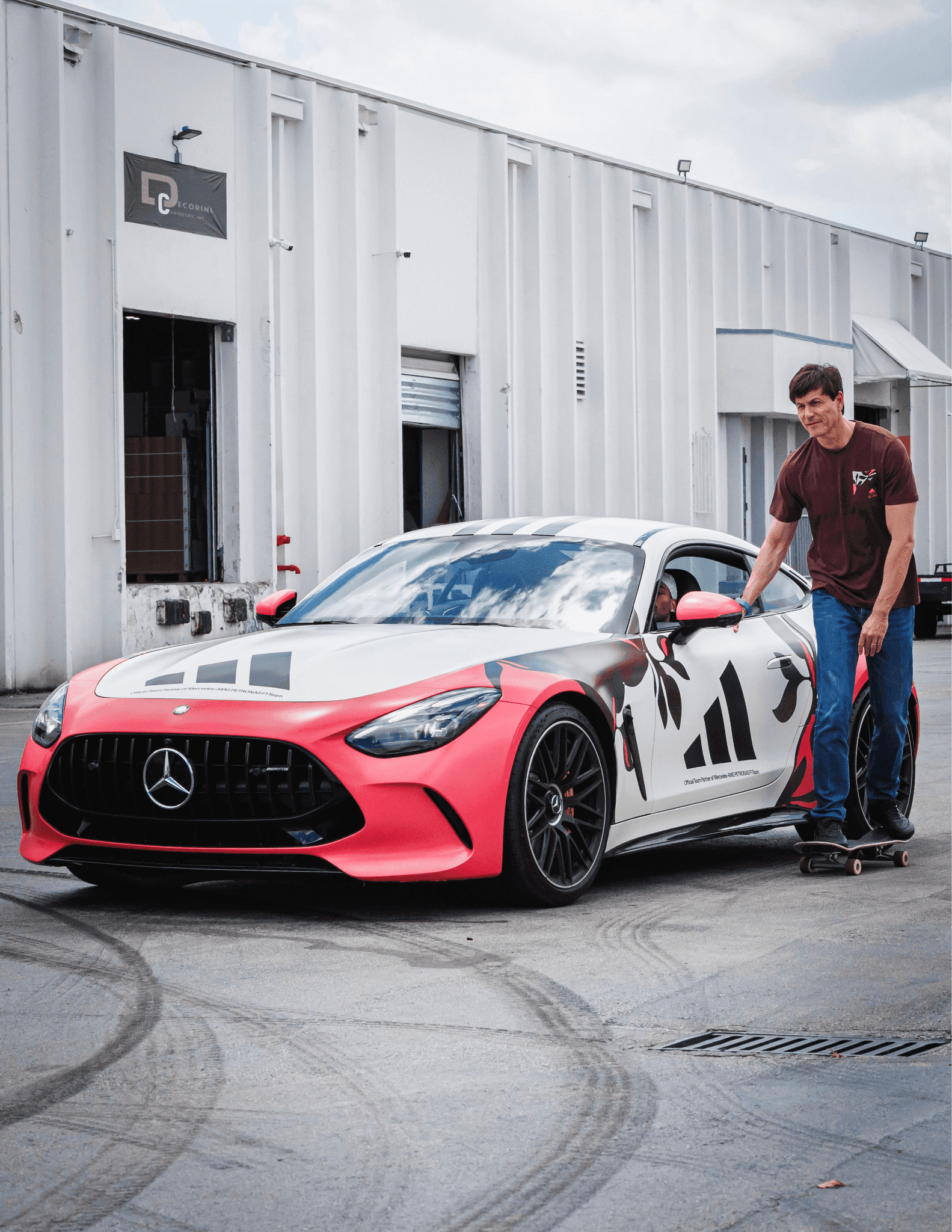 A Mercedes-AMG car with custom Adidas Skateboarding livery parked at the Miami stunt location.