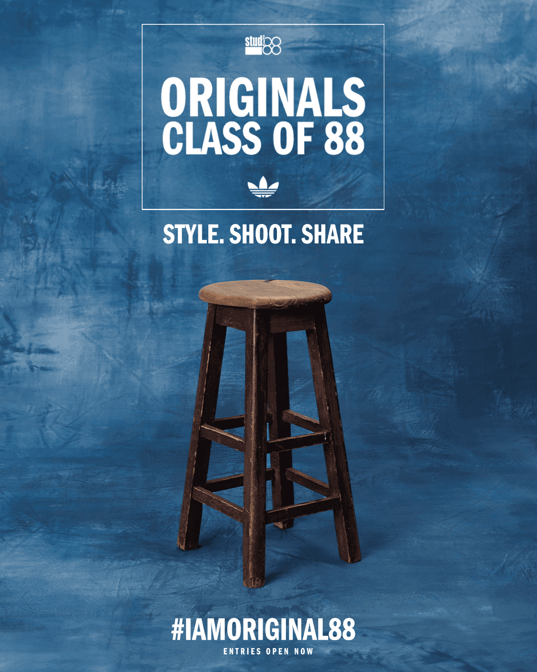 Empty wooden stool on a blue background for Studio 88 Originals Class of 88 campaign, announcing entries are open now.