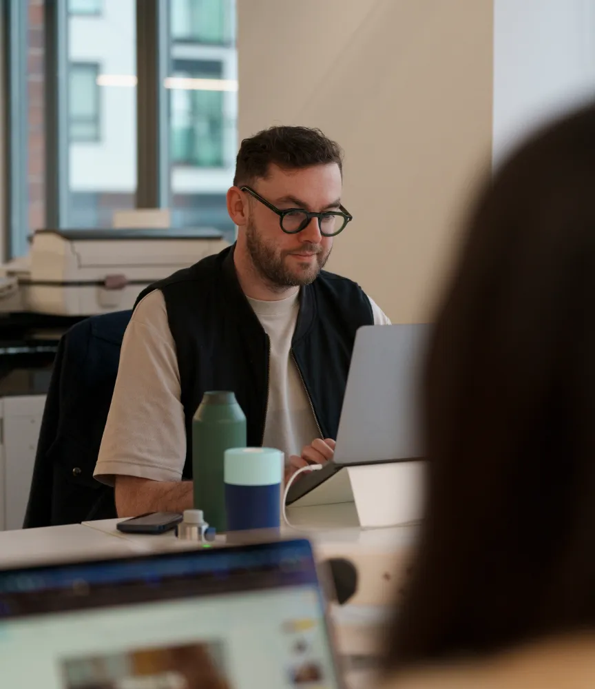 Man in office working on laptop