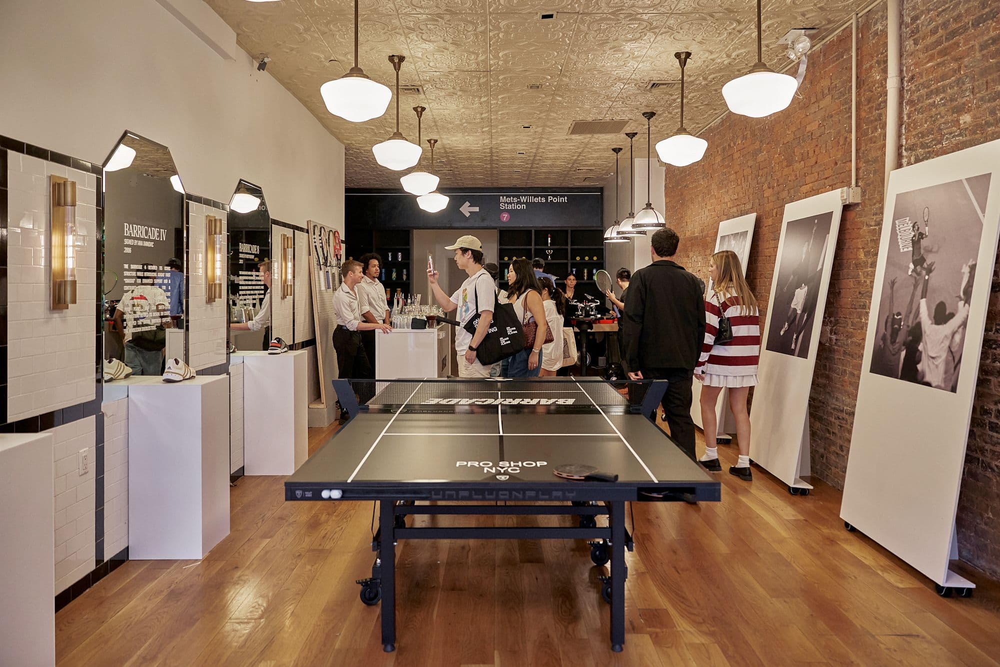 Interior of the activation space featuring a table tennis setup and product storytelling displays.