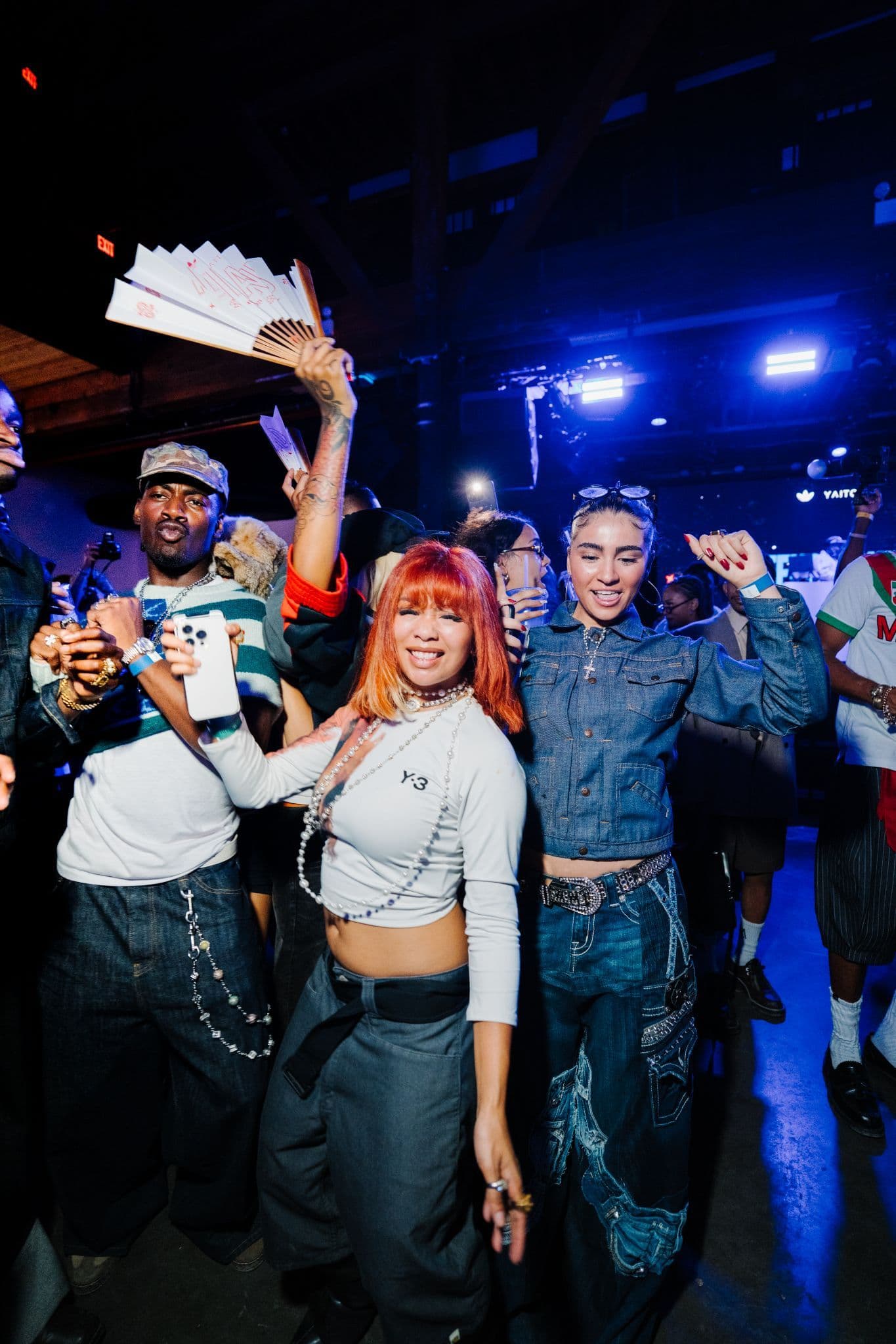 Ice Spice and guests posing together at the adidas Adiland NYFW event.