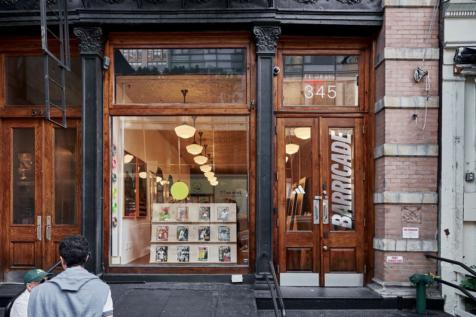Exterior view of Pro Shop NYC transformed into an adidas Barricade 25th anniversary archive.
