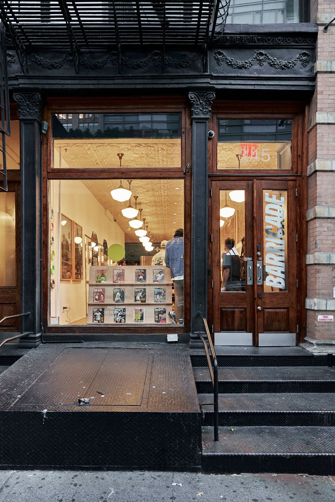 Street view of the Pro Shop NYC storefront featuring adidas Barricade branding.